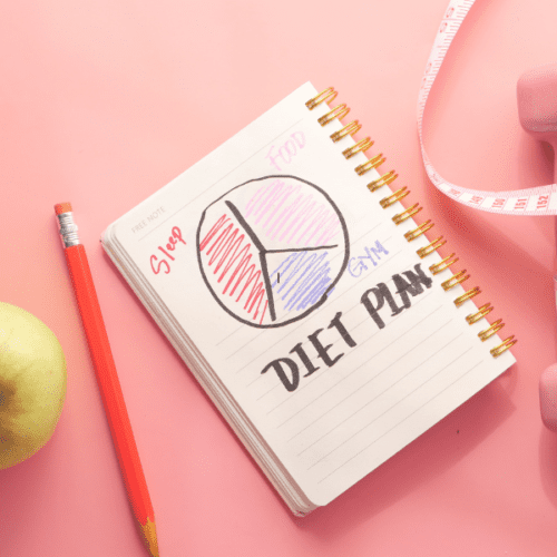 Chronic dieting symbols on pink background.